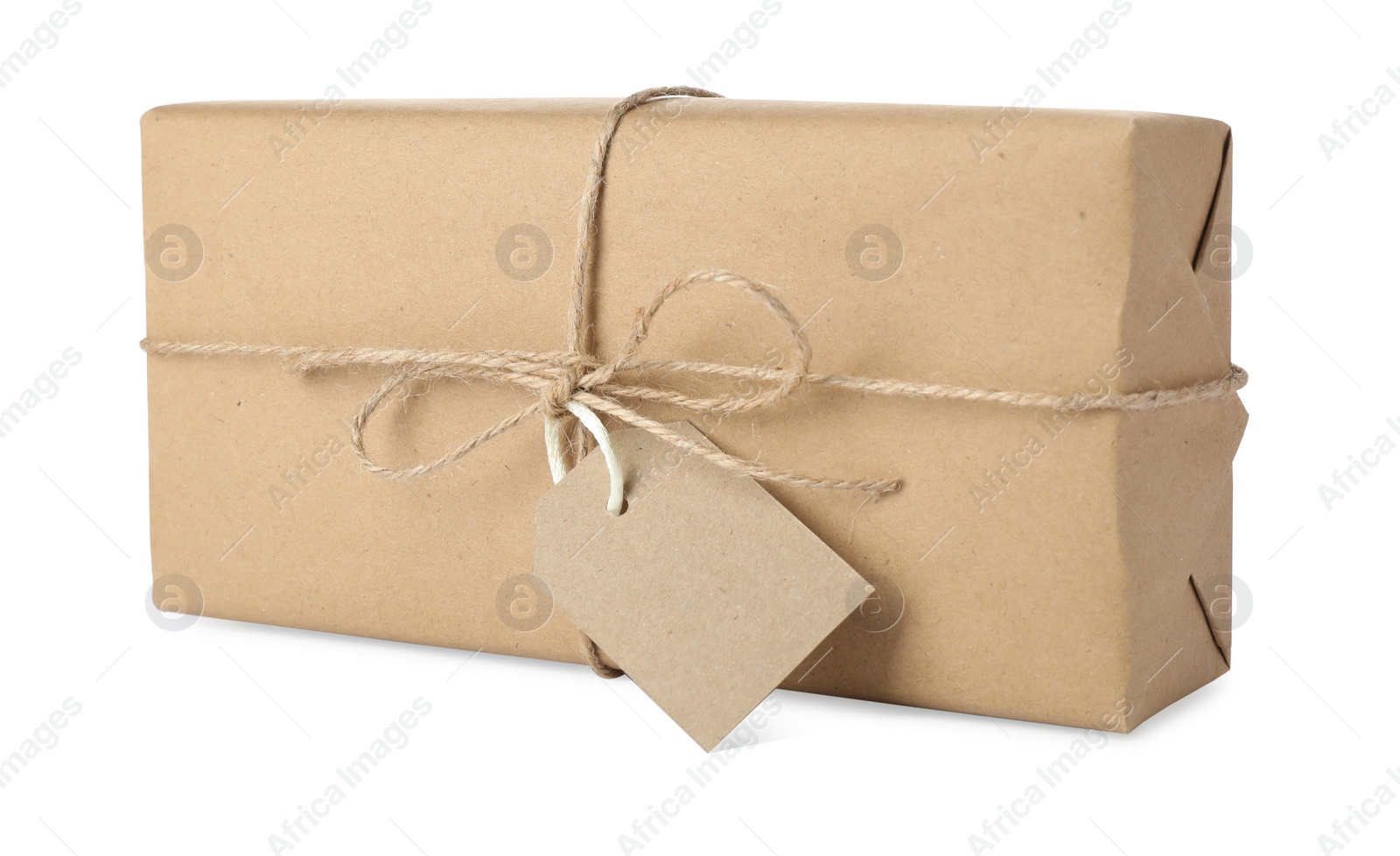 Photo of Parcel wrapped with kraft paper, twine and tag isolated on white