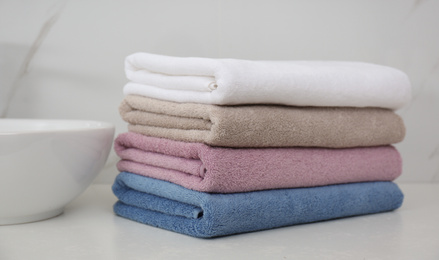 Stack of fresh towels in bathroom. Laundry day