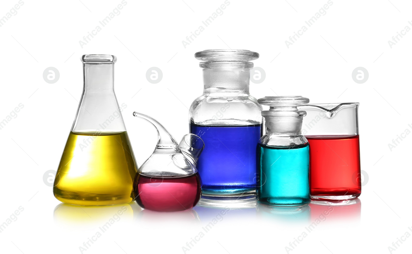 Photo of Set of different lab glassware with color liquid isolated on white