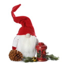 Photo of Funny Christmas gnome and festive decor on white background