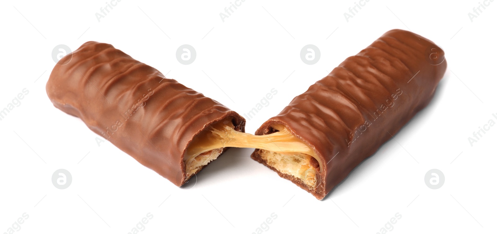 Photo of Pieces of chocolate bar with caramel on white background