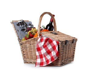 Photo of Wicker picnic basket with wine and different products on white background