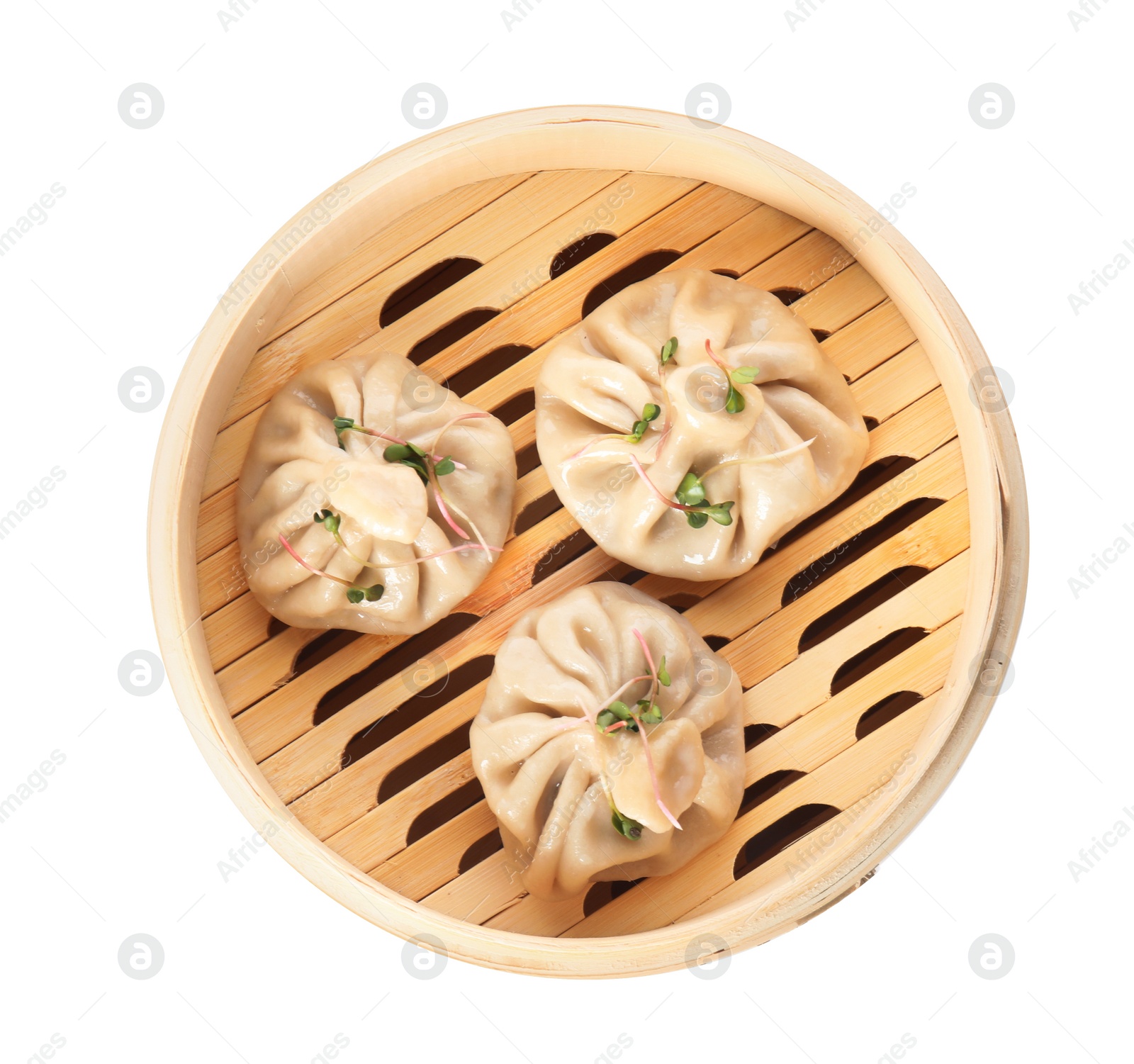 Photo of Bamboo steamer with tasty baozi dumplings on white background, top view