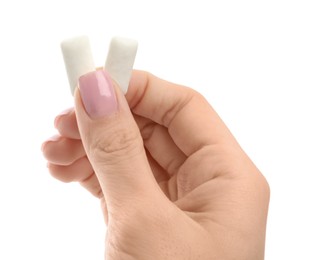 Photo of Woman holding chewing gum pieces on white background, closeup