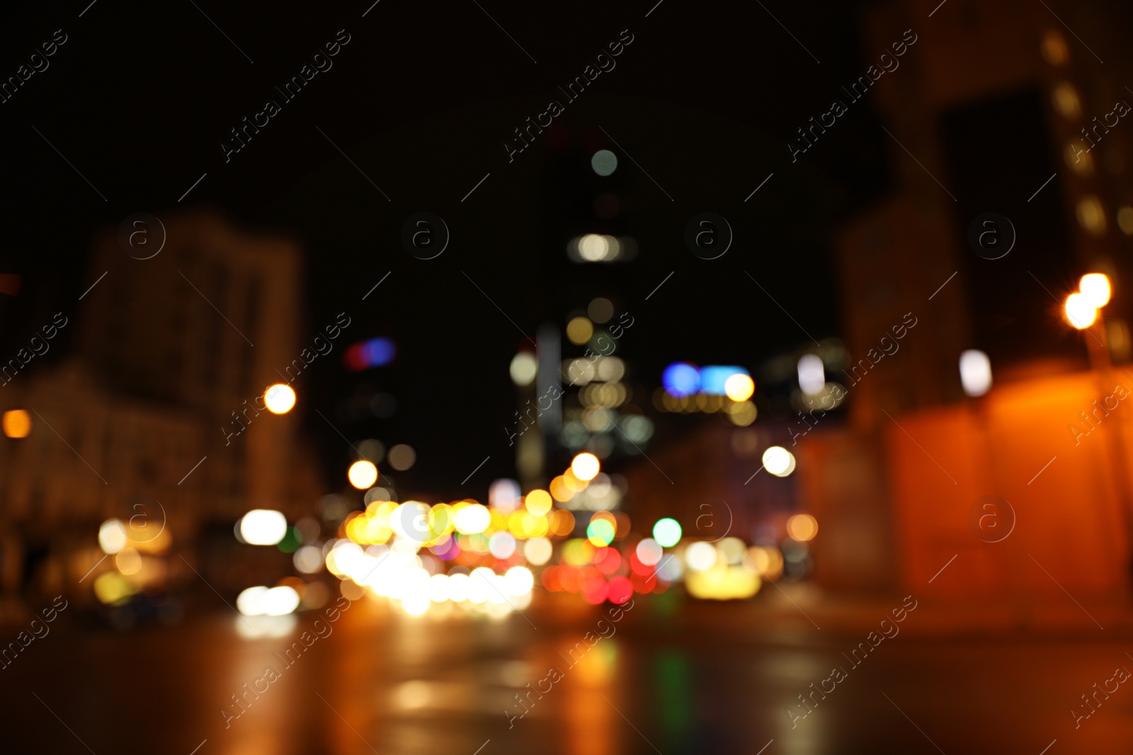 Photo of Blurred view of night cityscape with bokeh effect