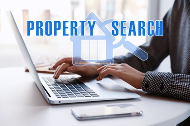 Image of Property search concept. Woman using laptop at table, closeup