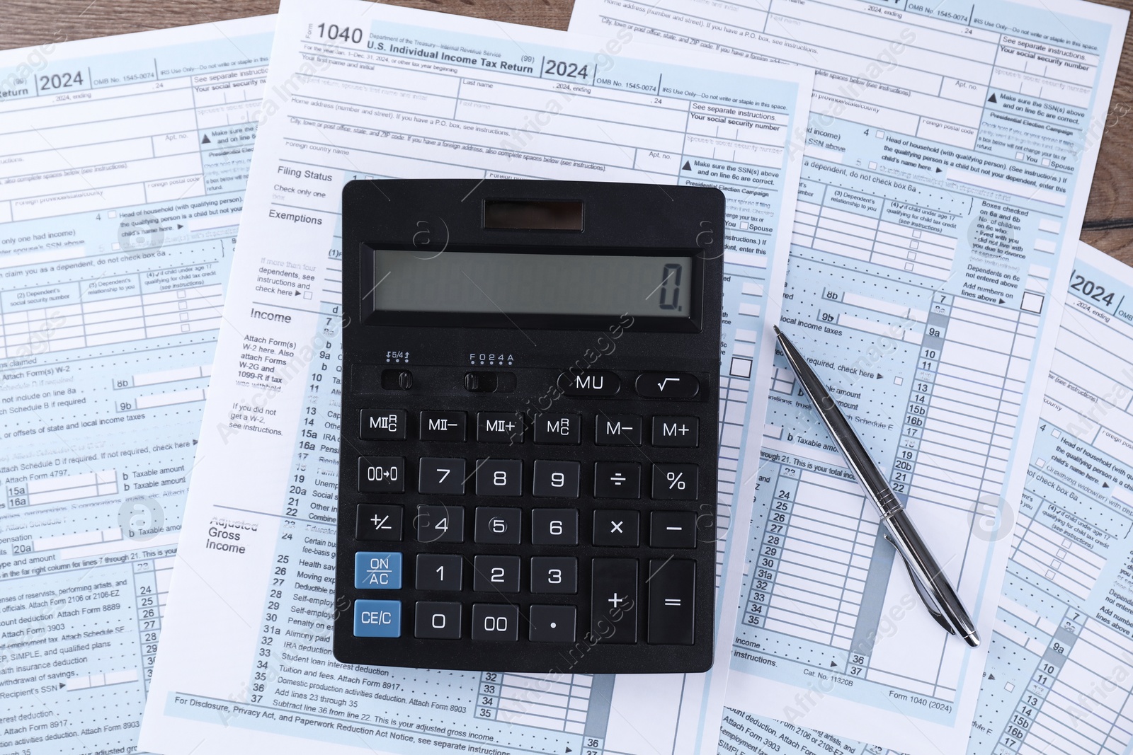 Photo of Tax accounting. Calculator, documents and pen on table, flat lay