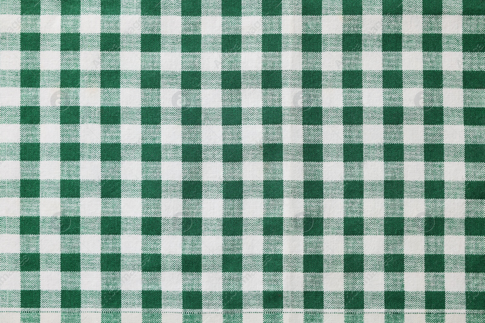 Photo of Green checkered tablecloth as background, top view