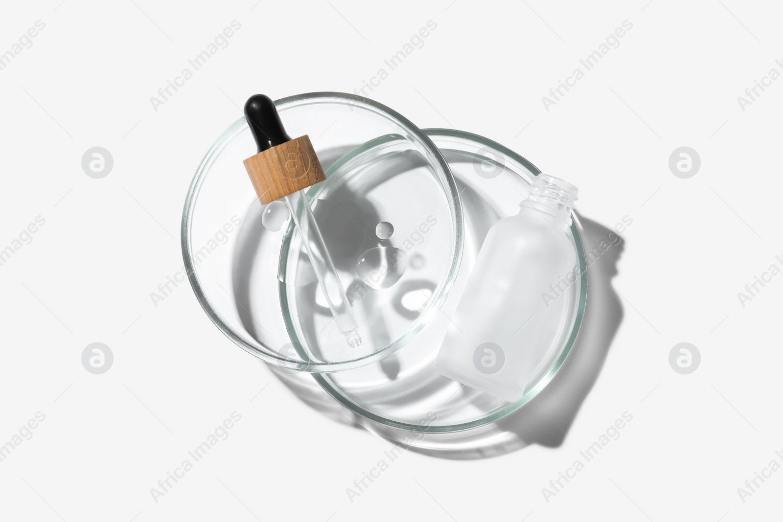 Photo of Petri dishes with cosmetic product on white background, top view
