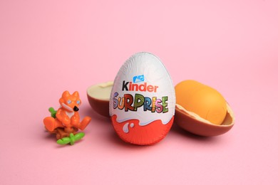 Sveti Vlas, Bulgaria - July 3, 2023: Kinder Surprise Eggs, plastic capsule and toy on pink background