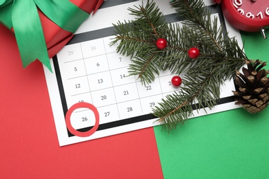 Photo of Flat lay composition with calendar on color background. Boxing day concept