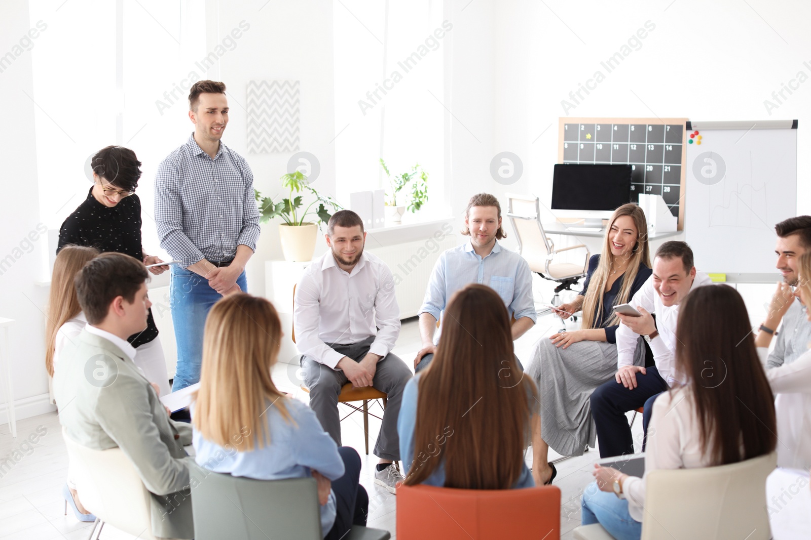 Photo of Young people having business training in office