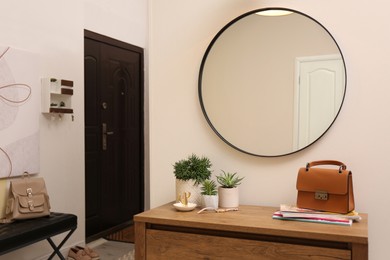 Photo of Modern hallway interior with stylish furniture and mirror