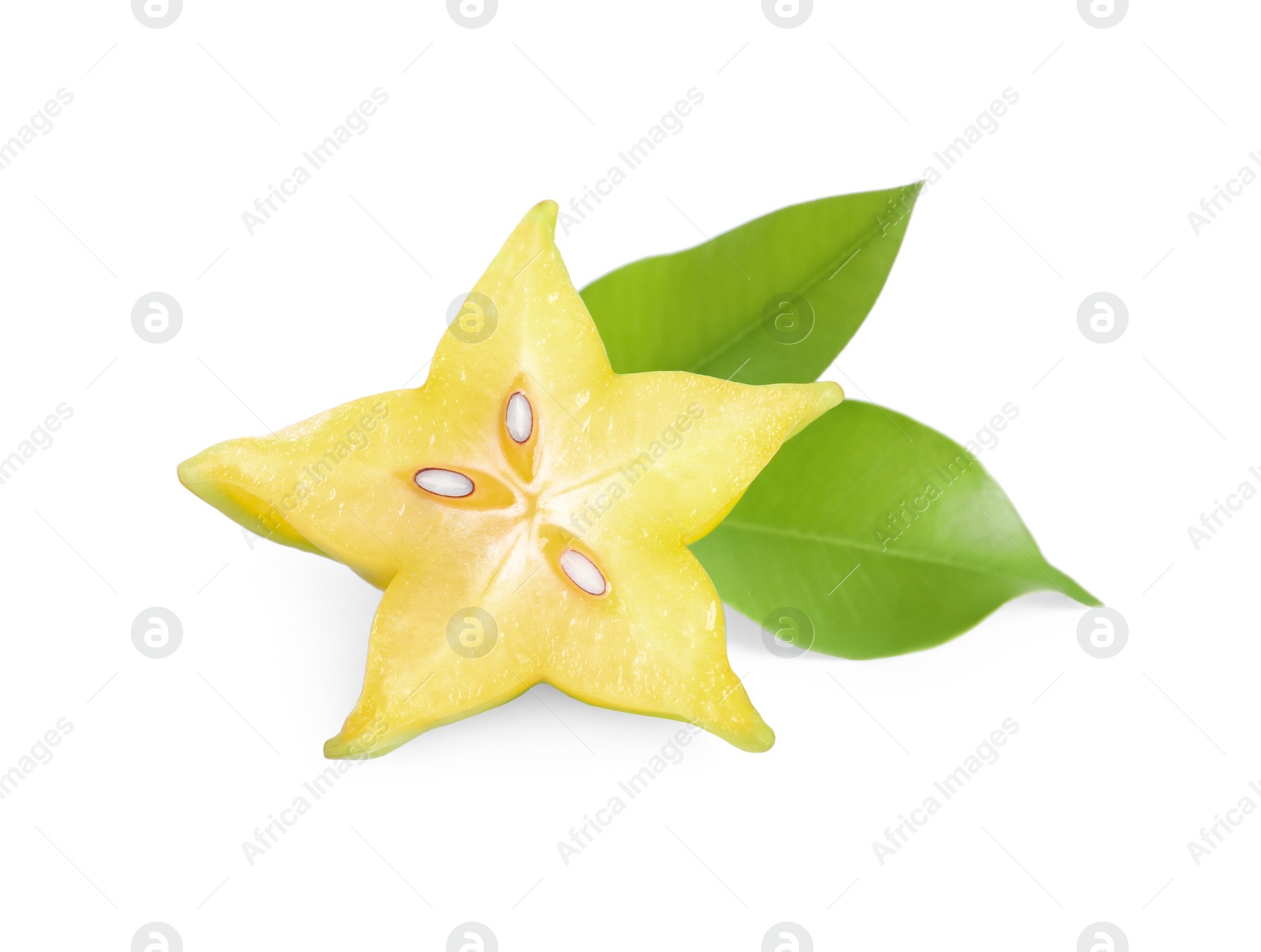 Photo of Slice of ripe carambola with green leaves on white background