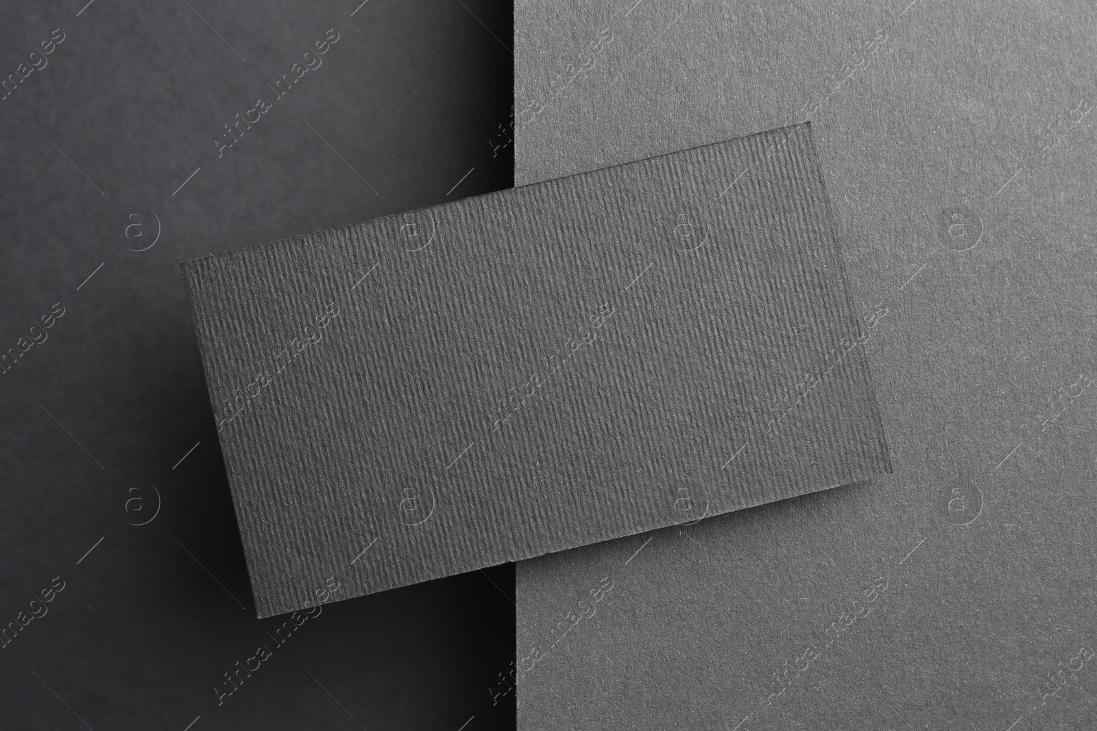 Photo of Blank business card on black background, top view. Mockup for design