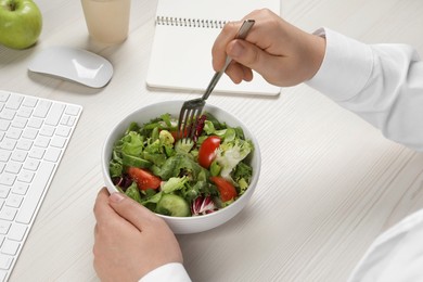 Photo of Office employee having business lunch at workplace, closeup