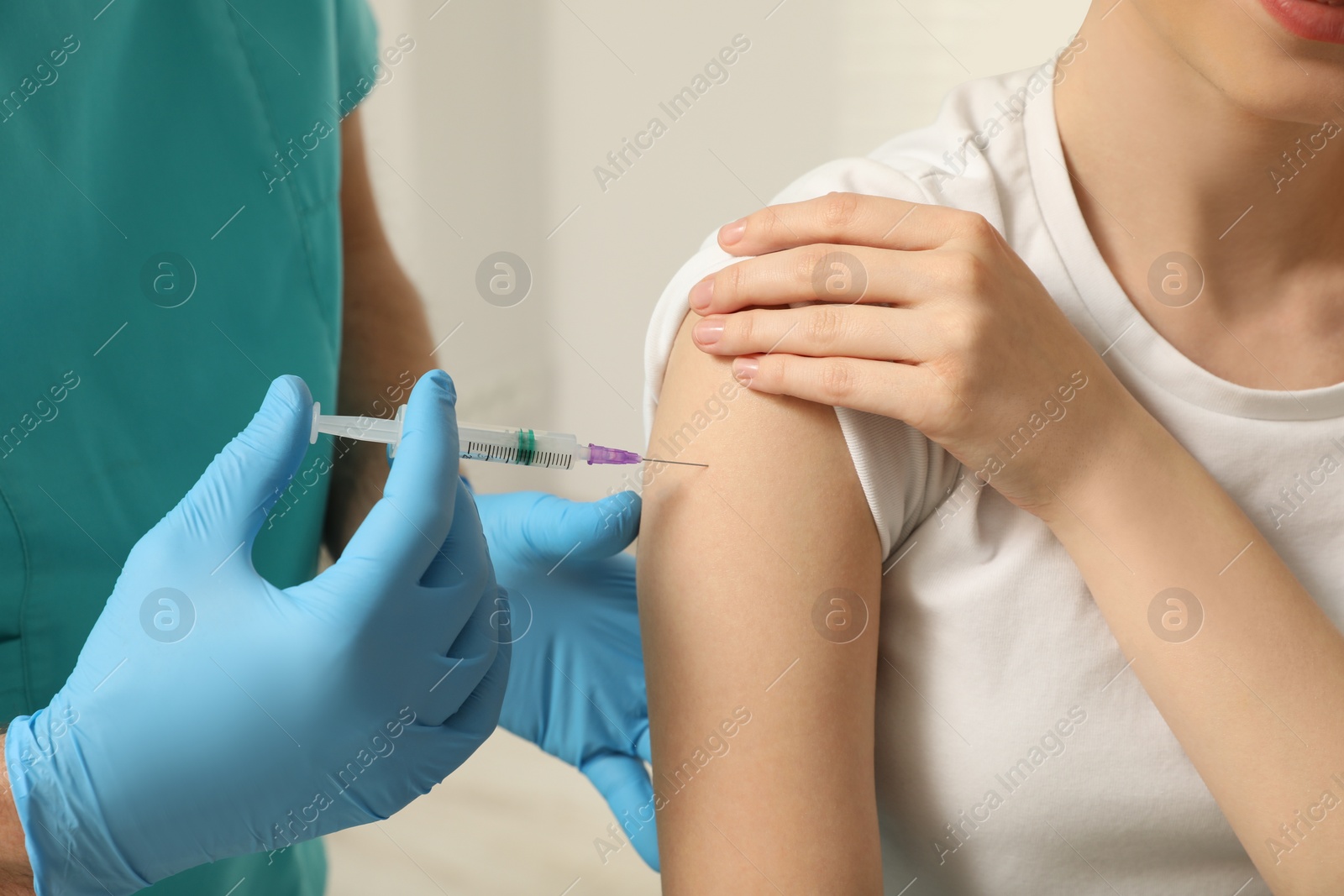 Photo of Doctor giving hepatitis vaccine to patient, closeup