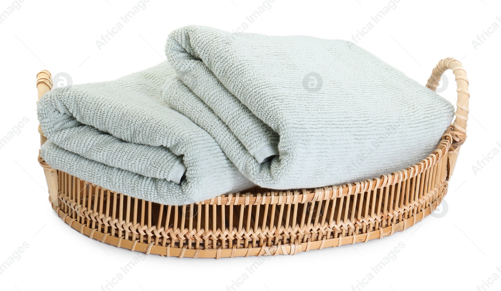 Photo of Basket with soft towels isolated on white