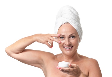 Portrait of beautiful mature woman with perfect skin holding jar of cream on white background