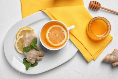 Flat lay composition with tea and therapeutic products on white background