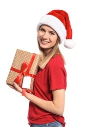 Young woman with Christmas gift on white background