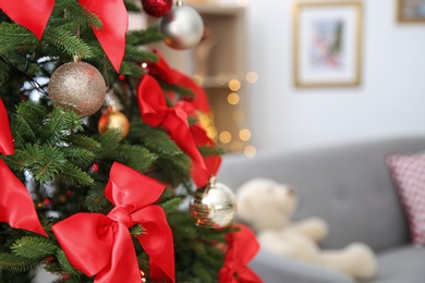 Photo of Christmas tree with stylish decor indoors, closeup