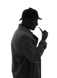 Photo of Old fashioned detective with smoking pipe on white background