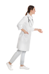 Photo of Doctor with stethoscope walking on white background