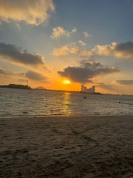 Photo of Beautiful view of sea and city at sunrise