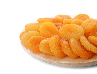 Photo of Wooden tray with tasty dried apricots isolated on white