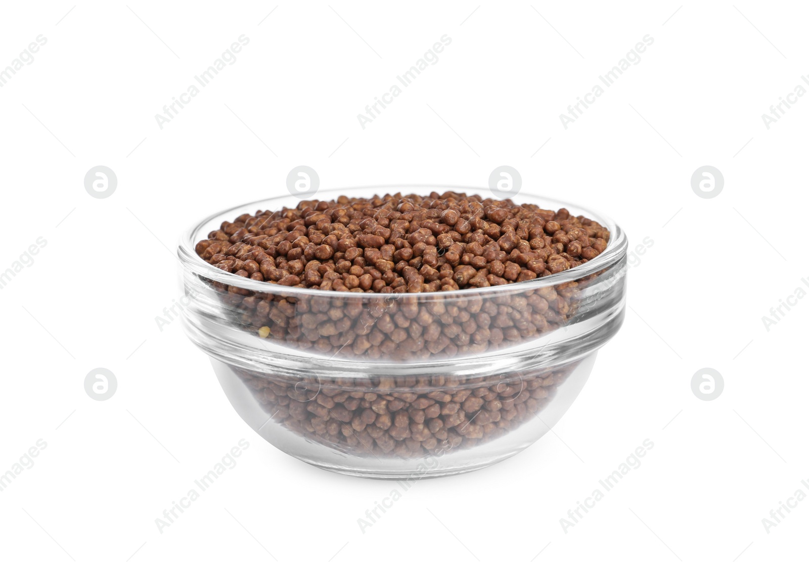 Photo of Buckwheat tea granules in glass bowl on white background