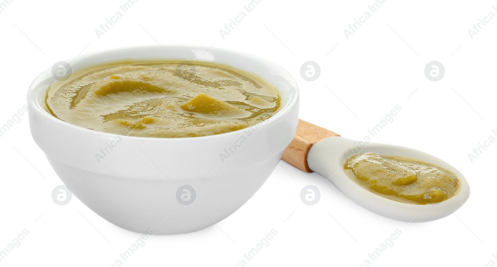 Photo of Bowl with healthy baby food and spoon isolated on white