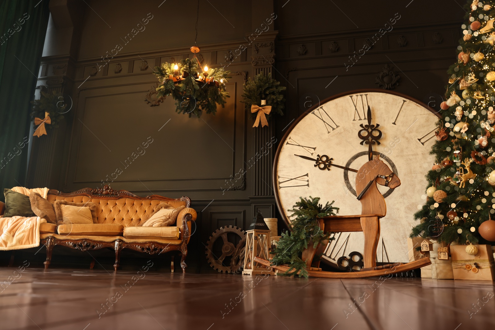 Photo of Stylish room interior with Christmas tree, big vintage clock and festive decor