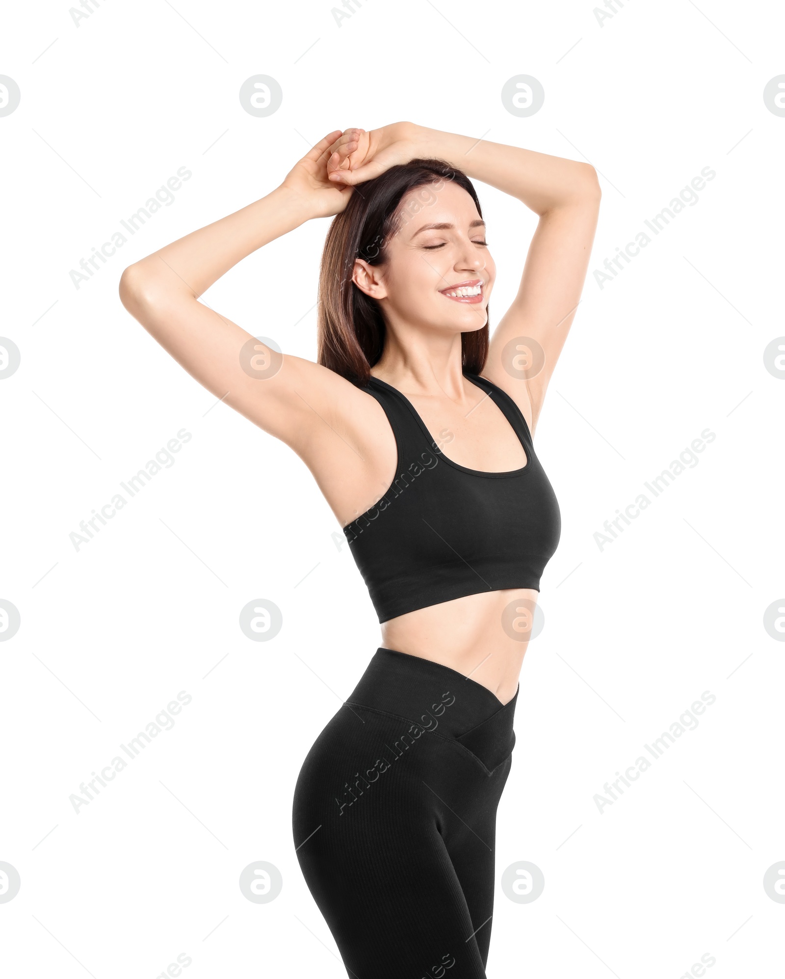 Photo of Happy young woman with slim body posing on white background