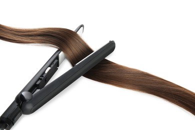 Modern straightener with brown hair lock on white background