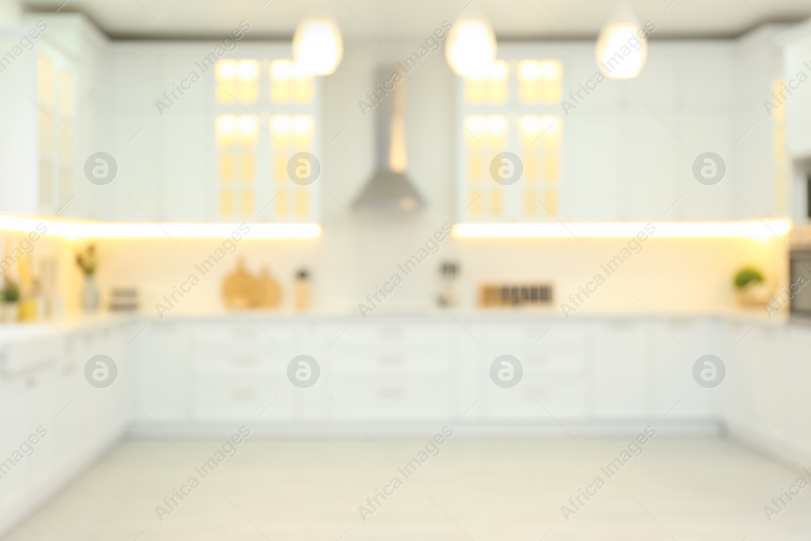 Photo of Blurred view of modern kitchen interior with stylish furniture