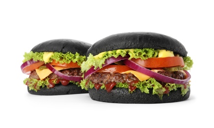 Tasty unusual black burgers isolated on white