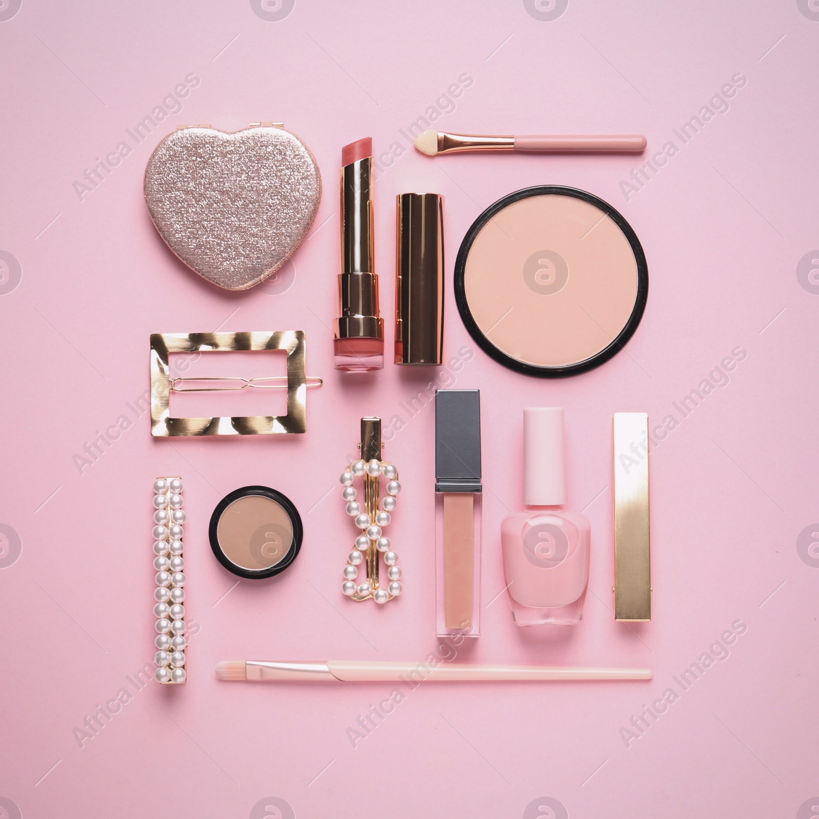 Photo of Flat lay composition with different cosmetic products on pink background