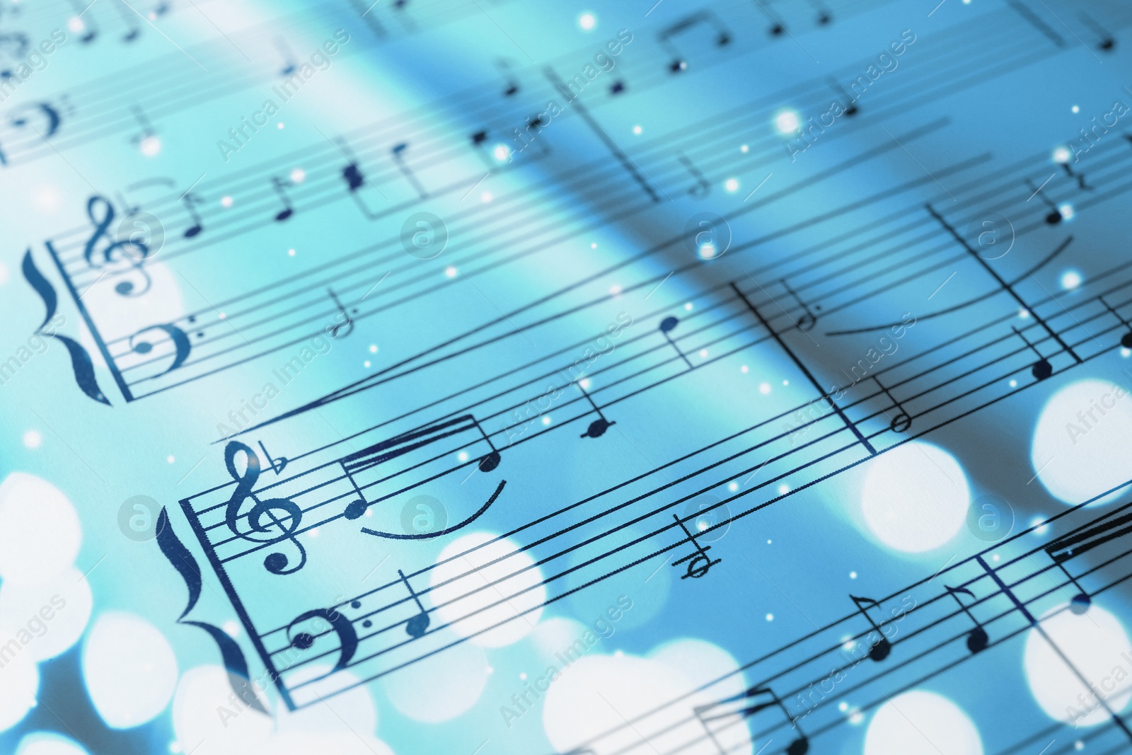 Image of Sheet with music notes as background, closeup. Bokeh and color tone effects