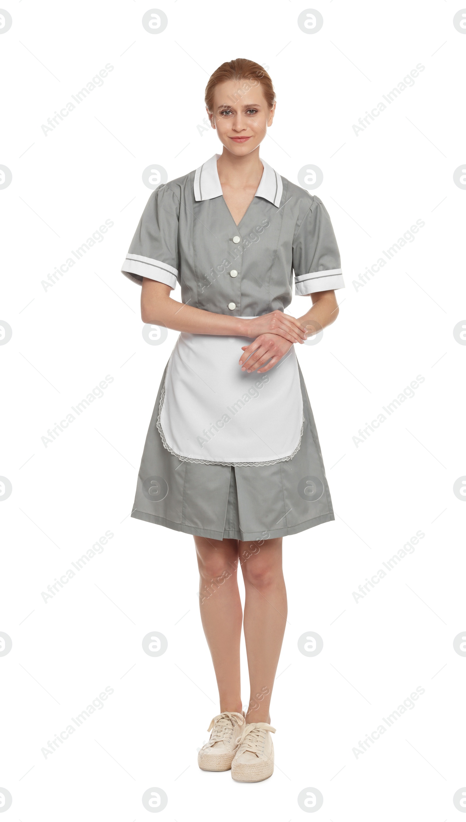 Photo of Full length portrait of chambermaid in tidy uniform on white background