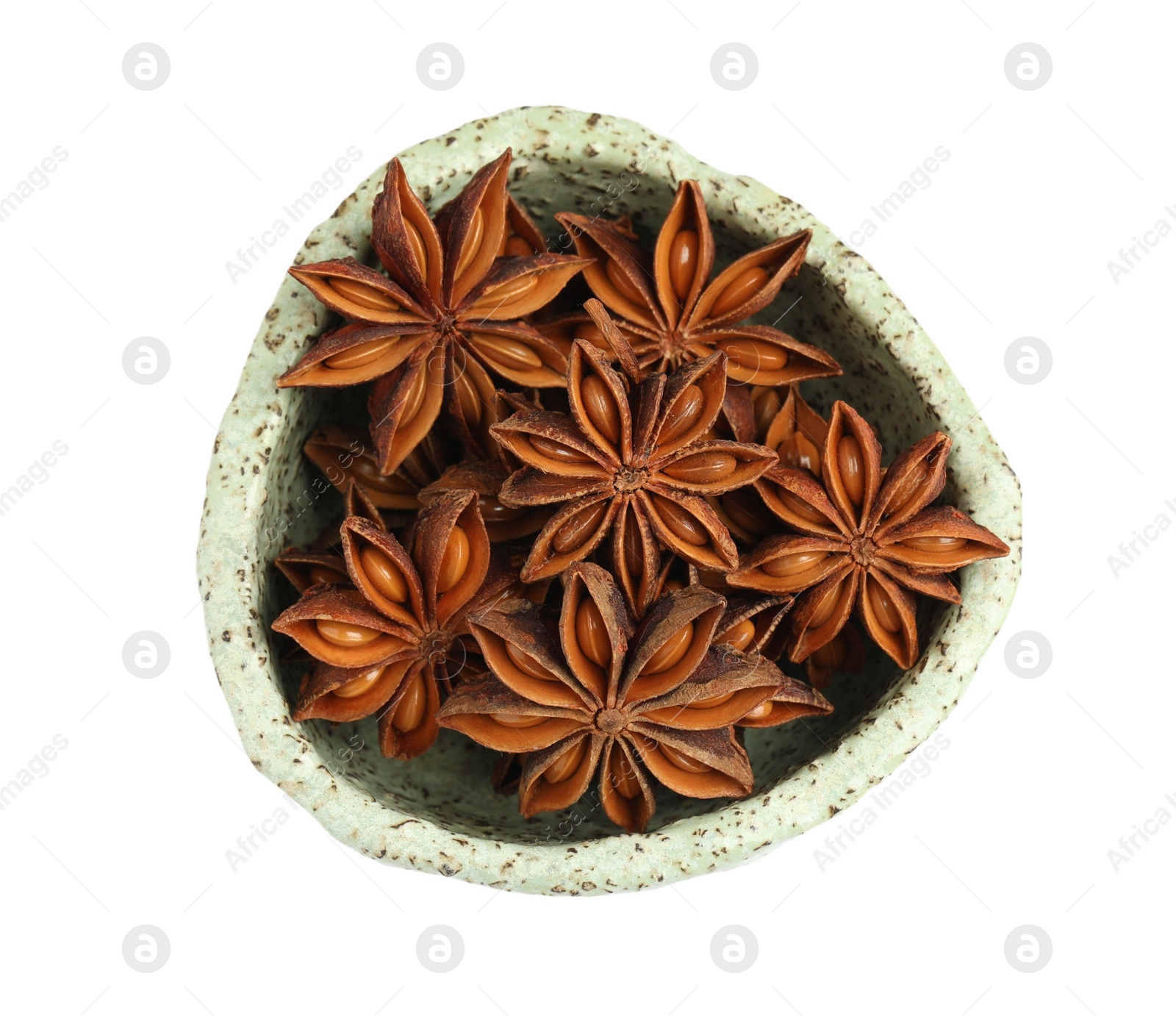 Photo of Bowl with dry anise stars on white background, top view