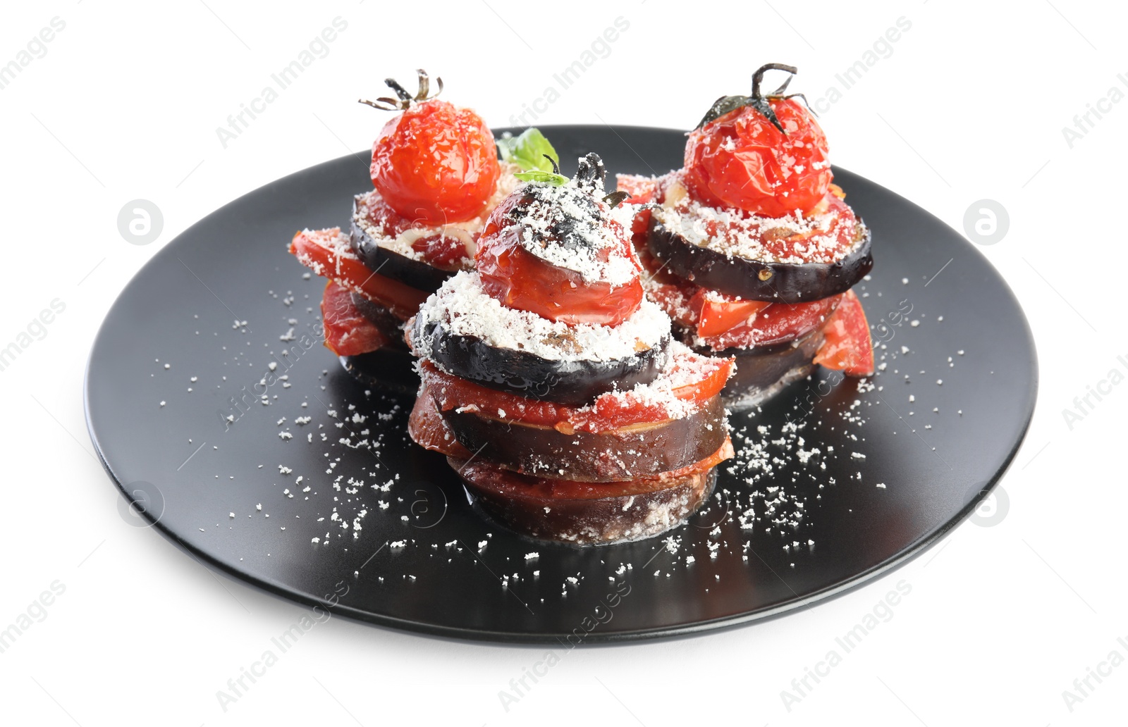 Photo of Baked eggplant with tomatoes, cheese and basil in plate isolated on white