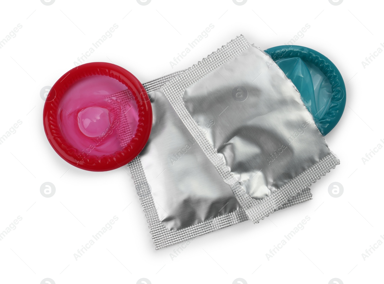 Photo of Unpacked condom and packages on white background, top view. Safe sex