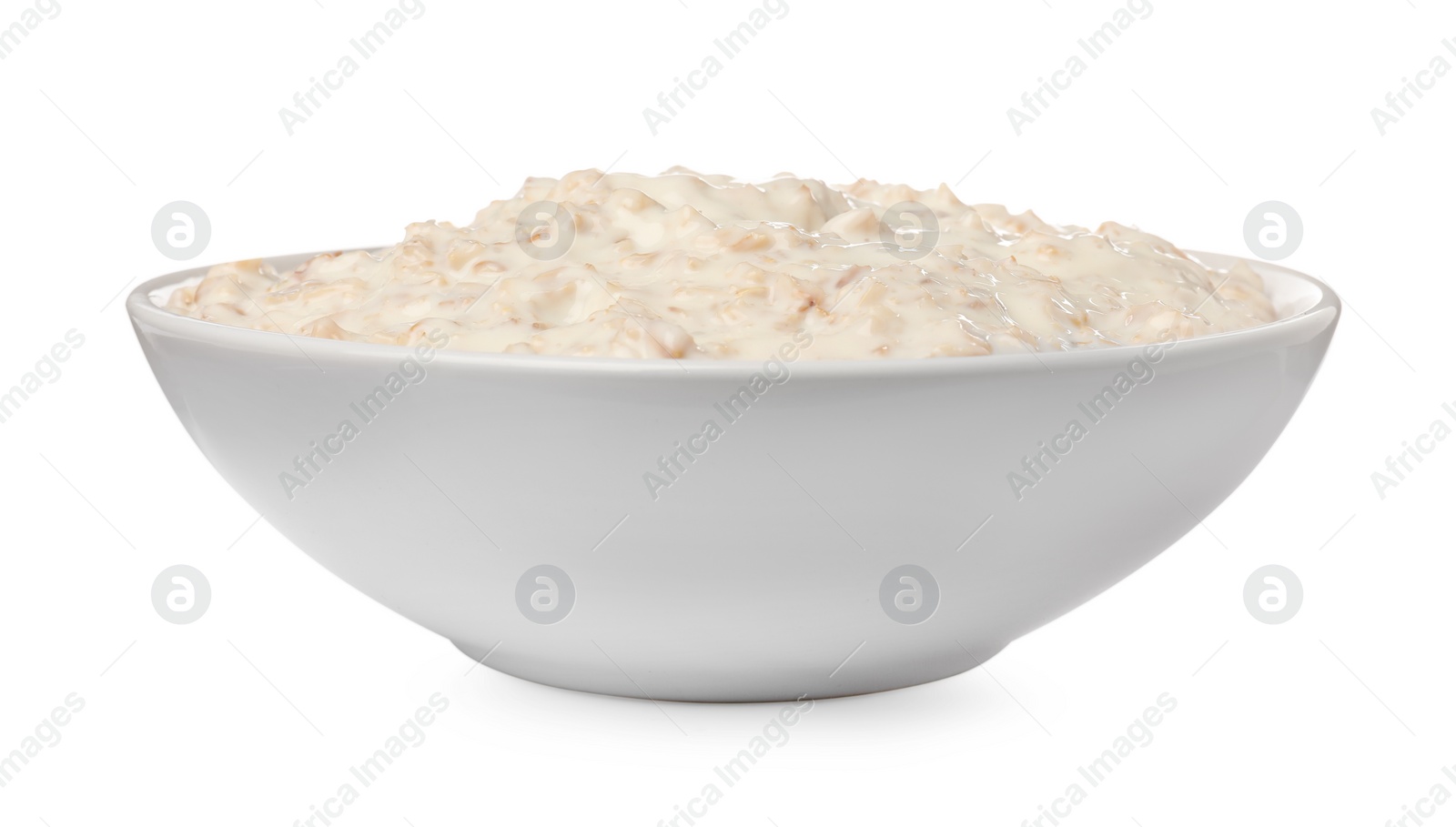 Photo of Tasty boiled oatmeal in bowl isolated on white