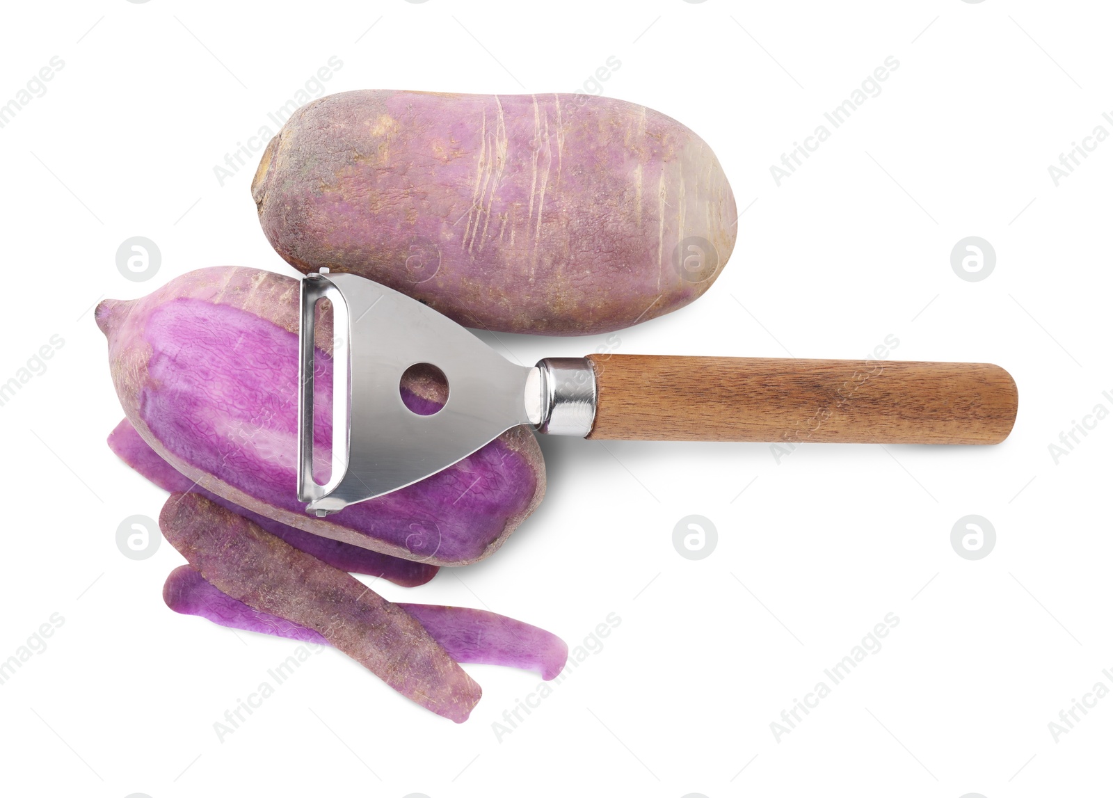 Photo of Ripe purple daikon radishes and peeler isolated on white, top view