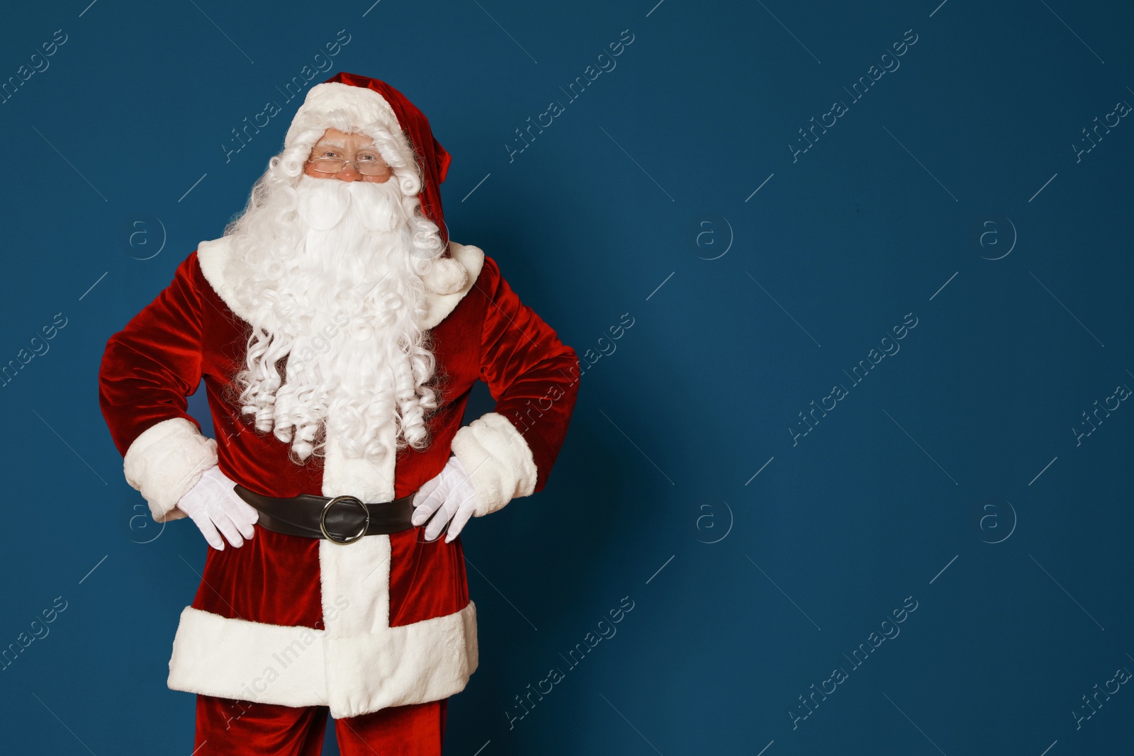 Photo of Authentic Santa Claus on blue background. Space for text
