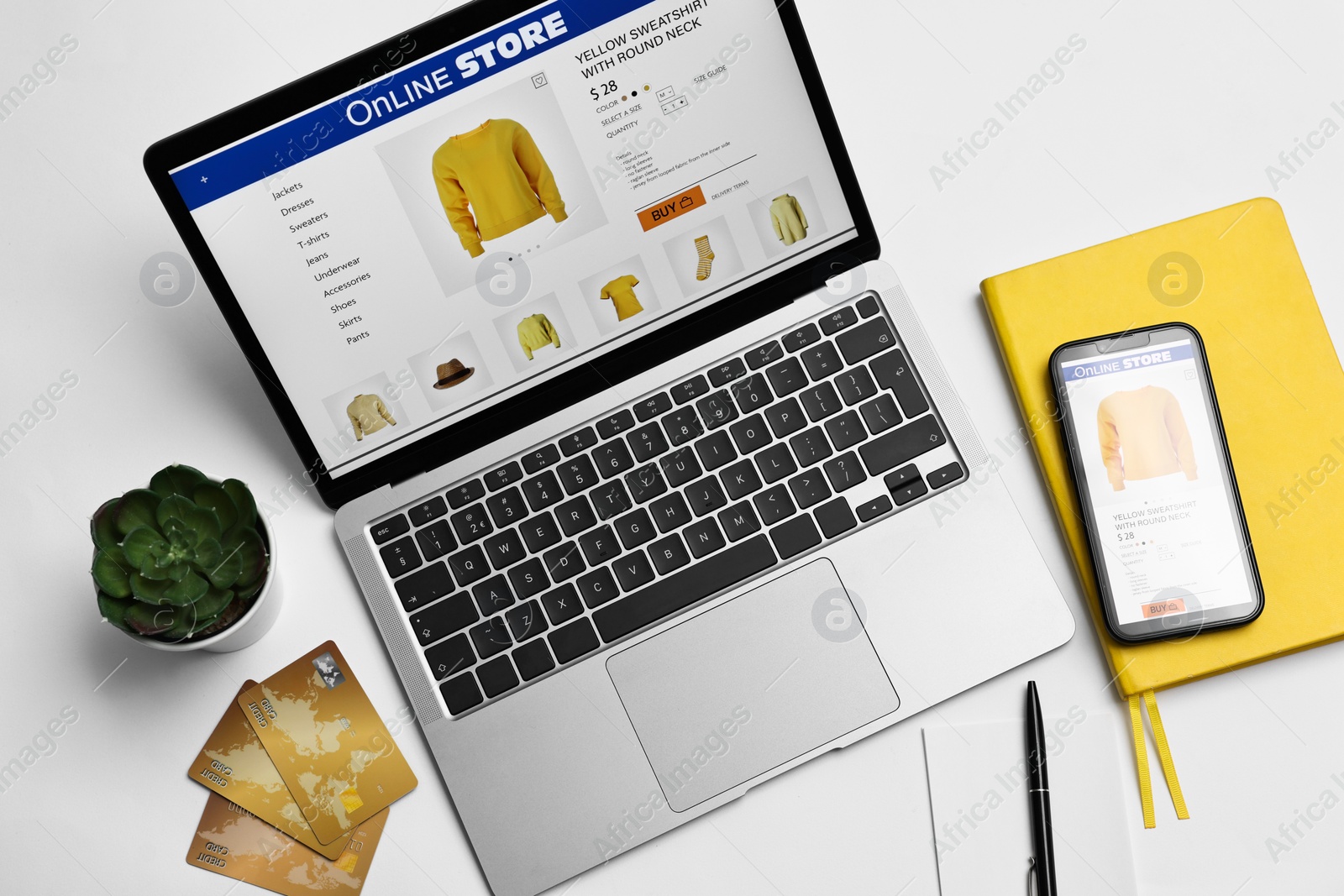 Photo of Online shopping. Composition with laptop on white background, above view