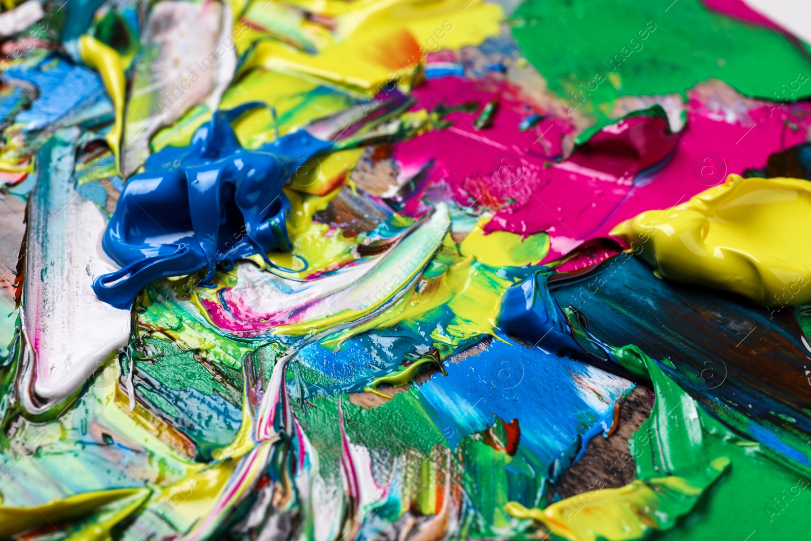 Photo of Abstract colorful acrylic paint as background, closeup view