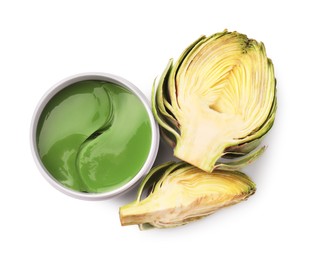 Photo of Package of under eye patches and artichokes on white background, top view. Cosmetic product