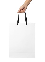 Photo of Woman holding paper shopping bag isolated on white, closeup